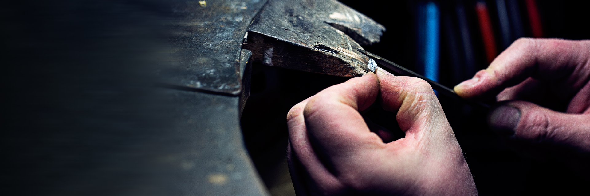 A jeweller working on a diamond